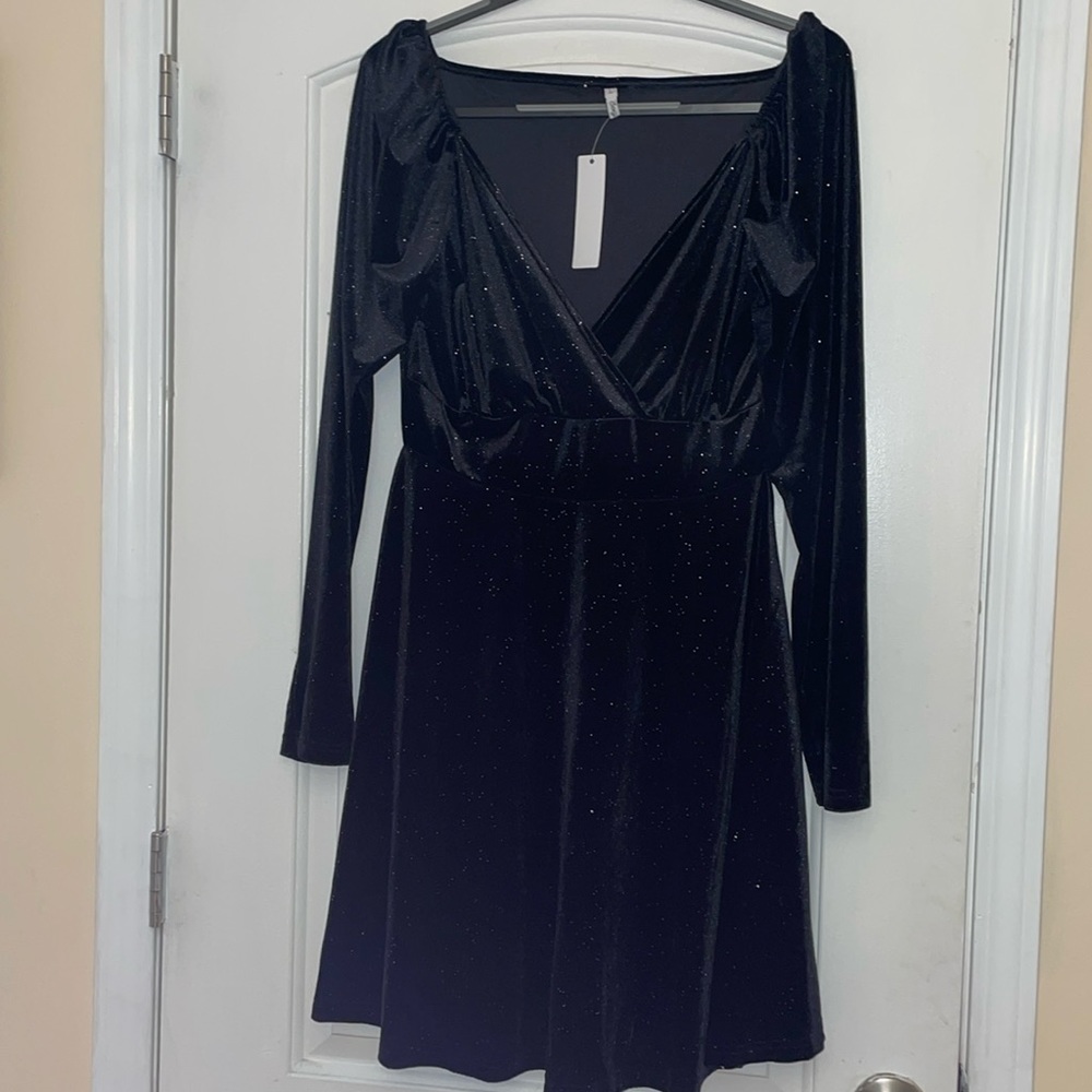 Black shiny dress. Size large, brand new with tags.